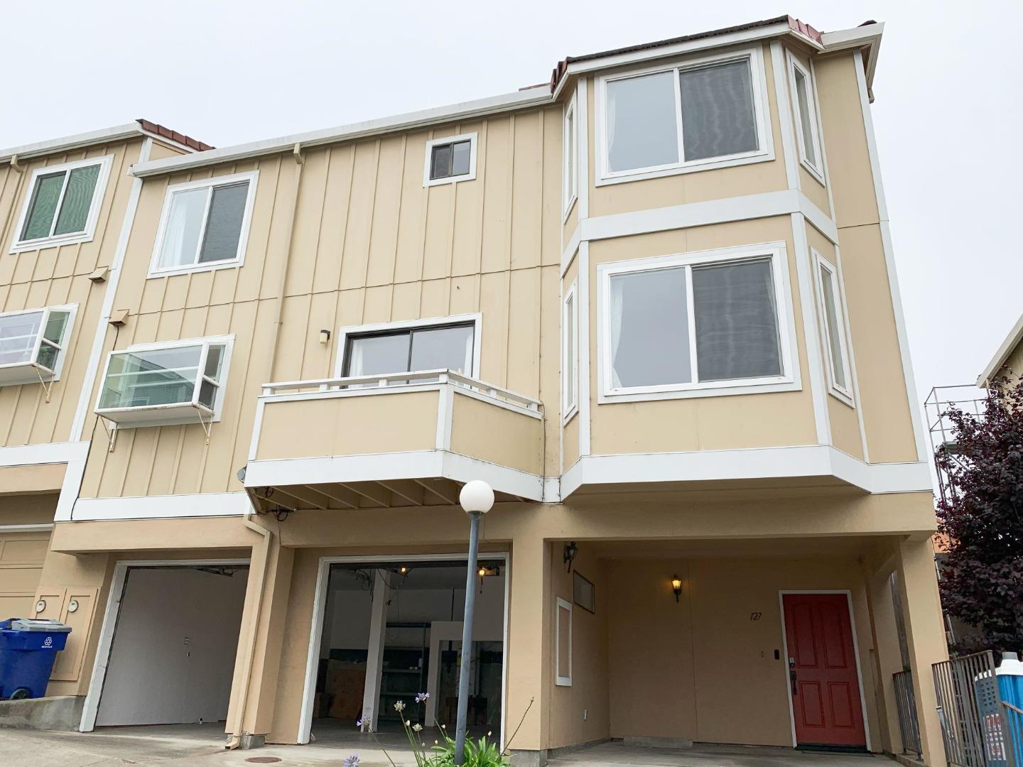 a front view of a house with a garage