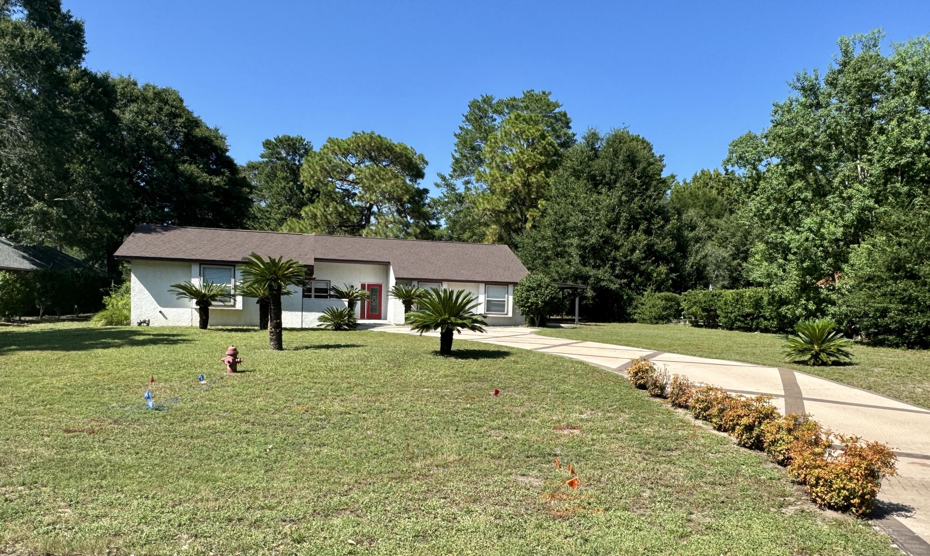 a house with trees in the background