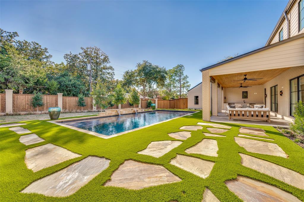 a view of a swimming pool with a lounge chair