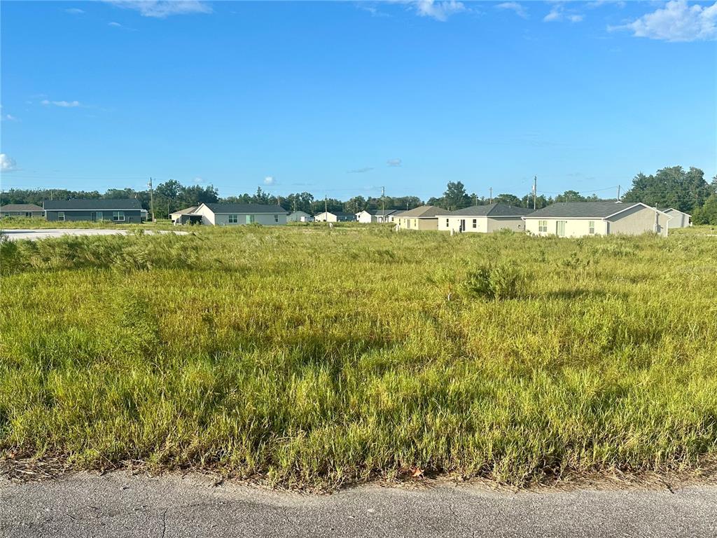 a view of a lake with a big yard