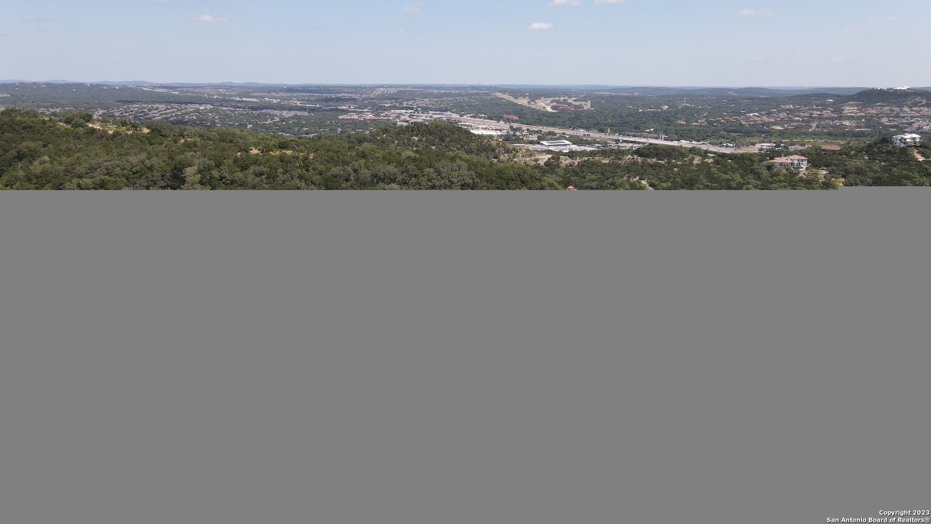 an aerial view of mountain with city view