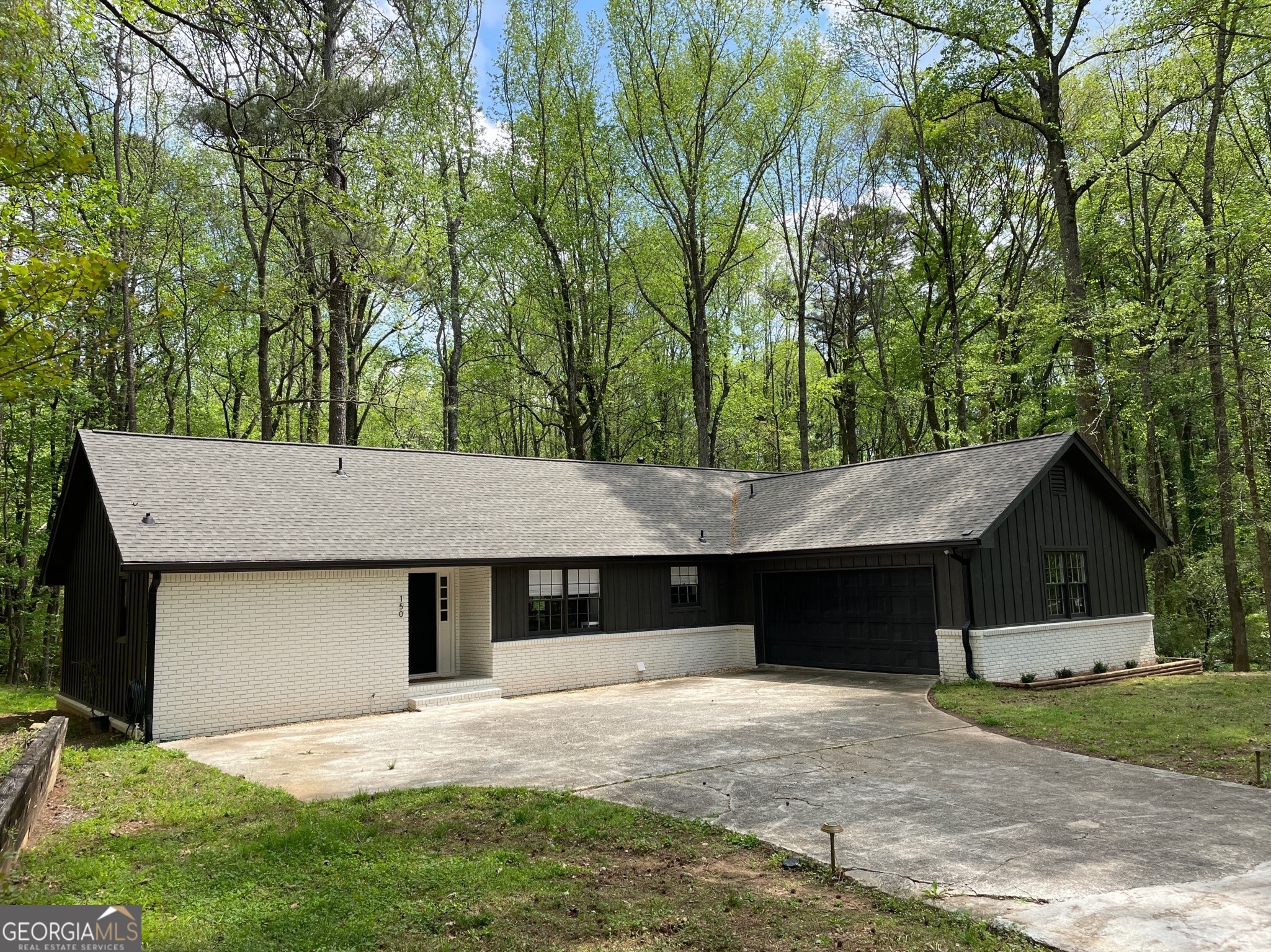 front view of a house with a yard