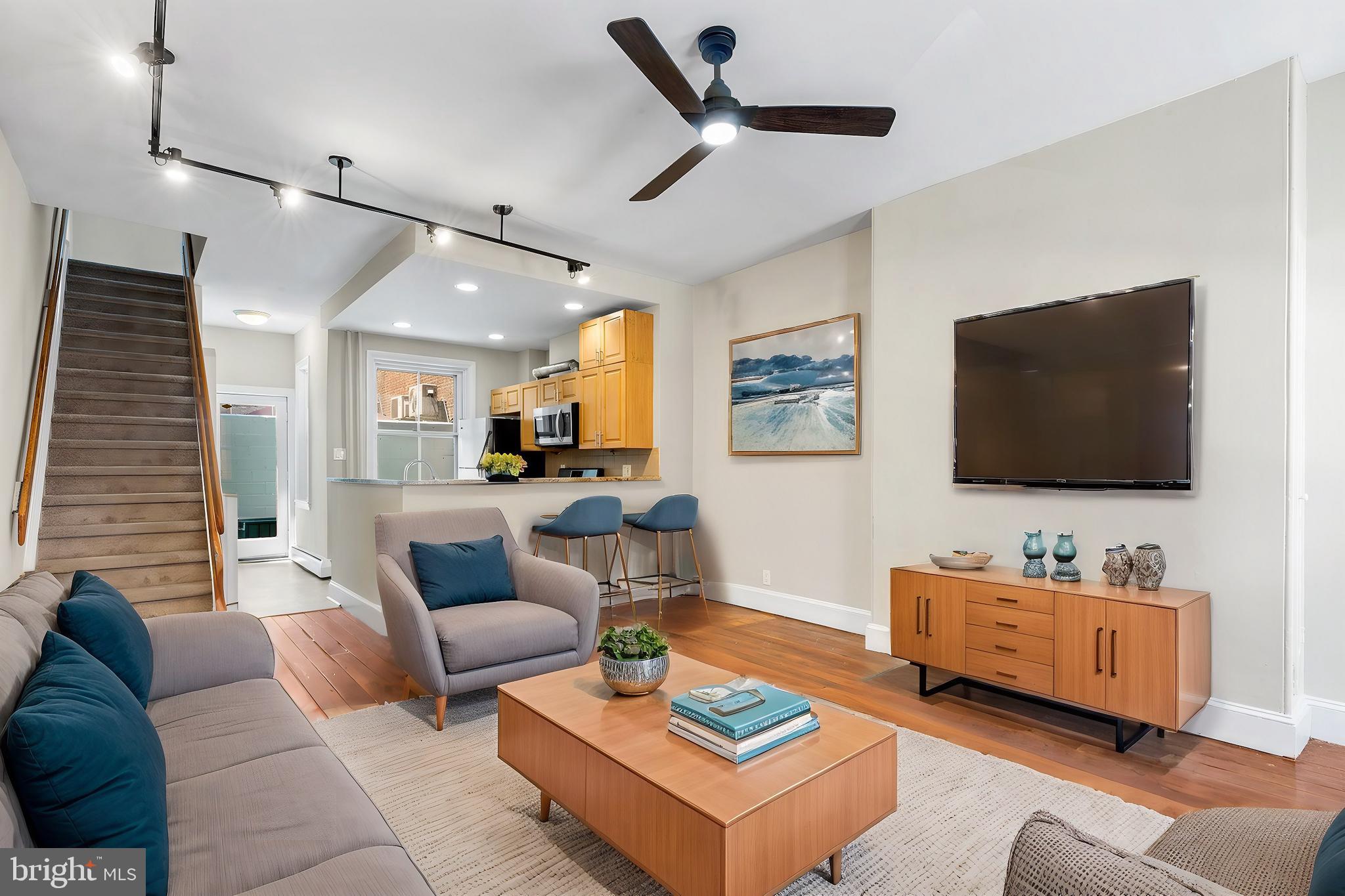 a living room with furniture and a flat screen tv