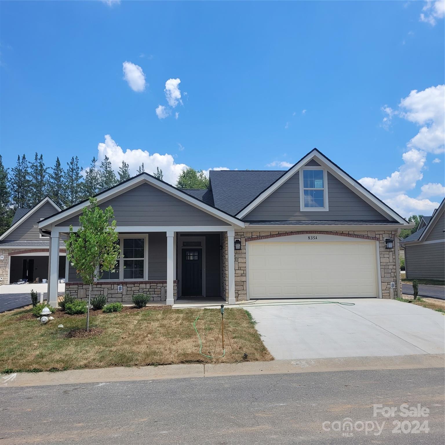 a front view of a house with garage