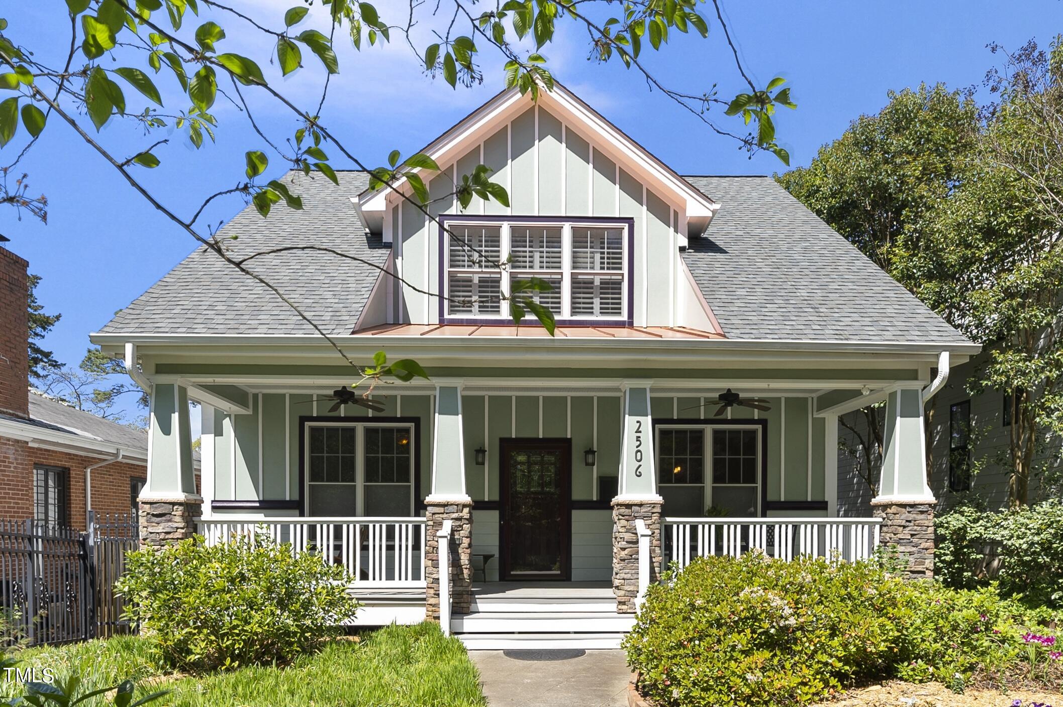 front view of a house with a small yard