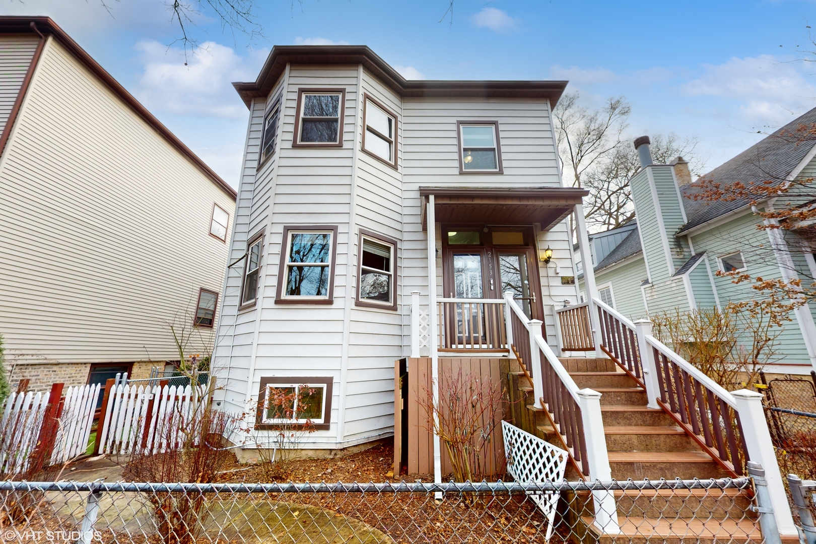 a view of a house with wooden stairs