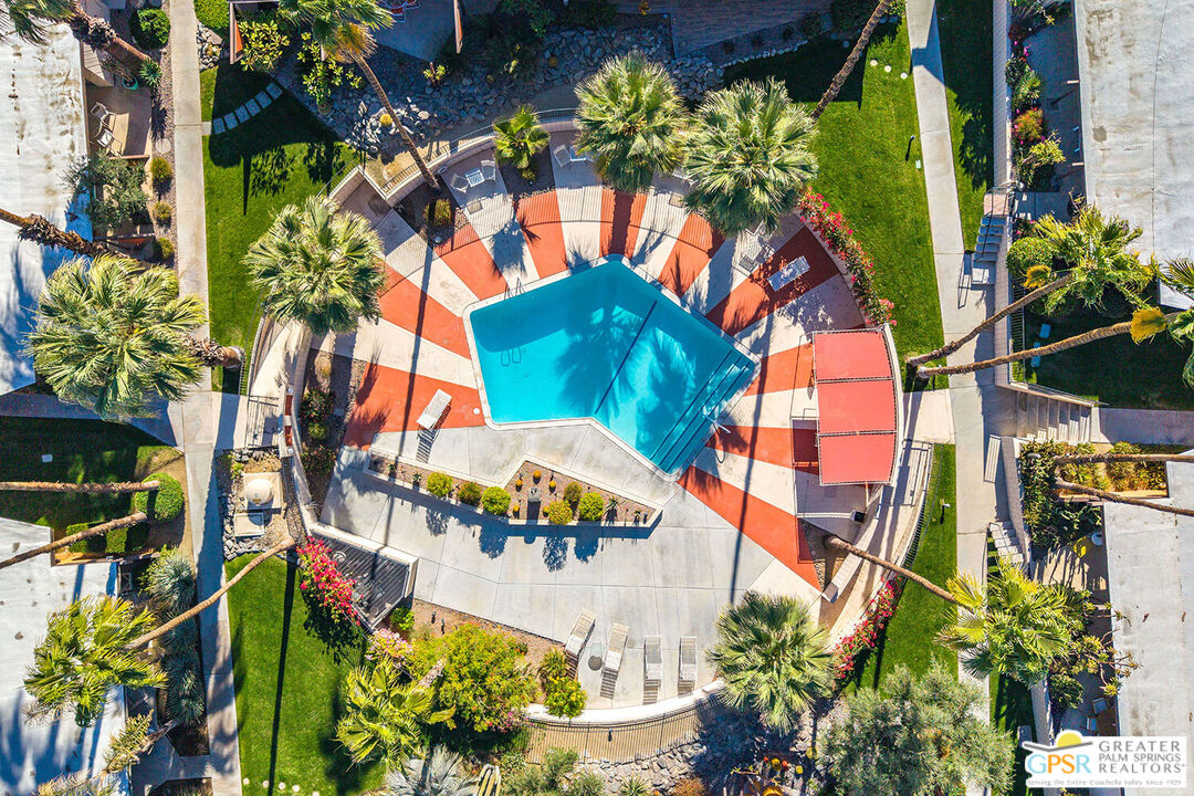 an aerial view of residential houses with outdoor space and street view