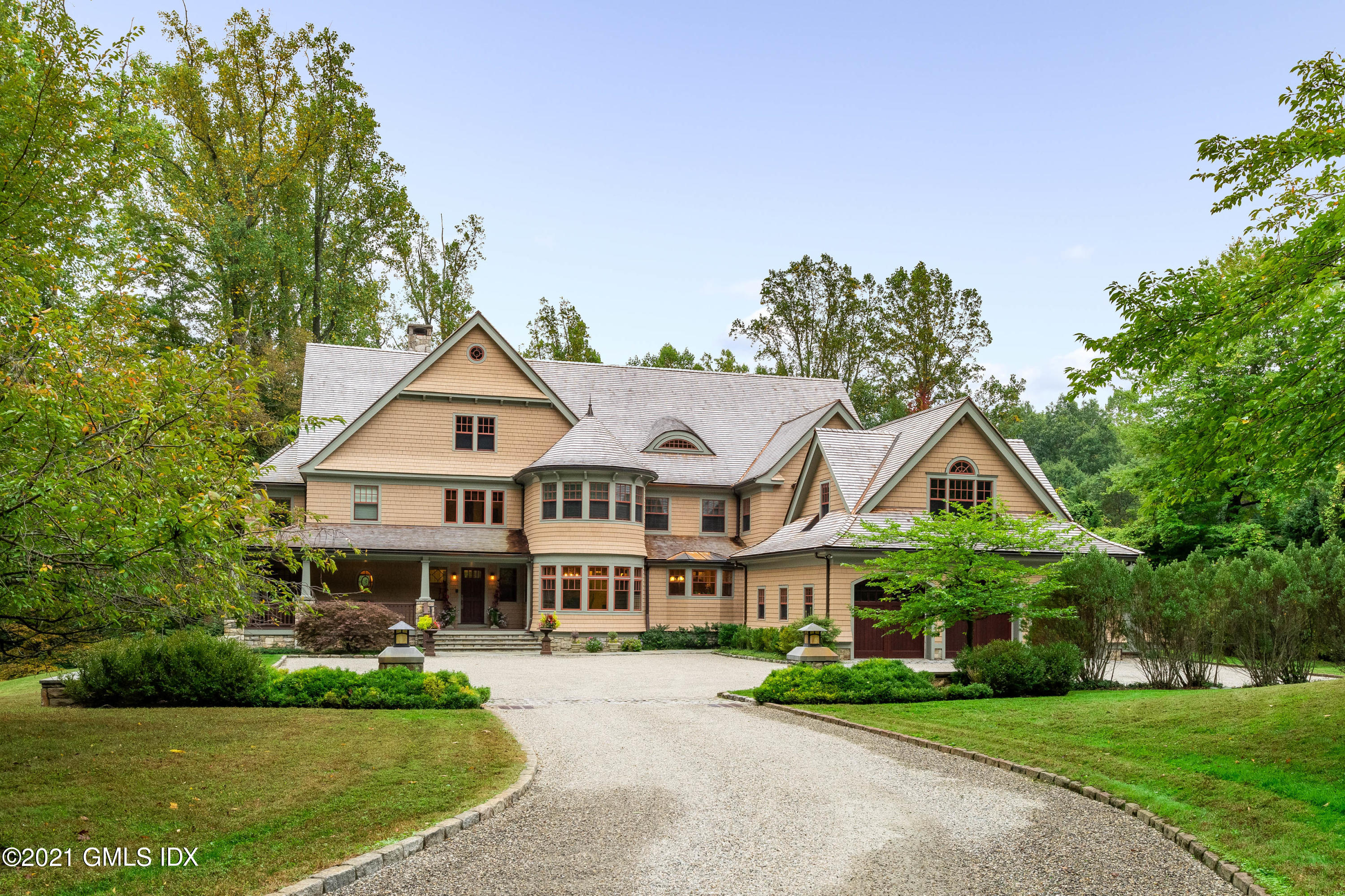 a view of house with yard and green space