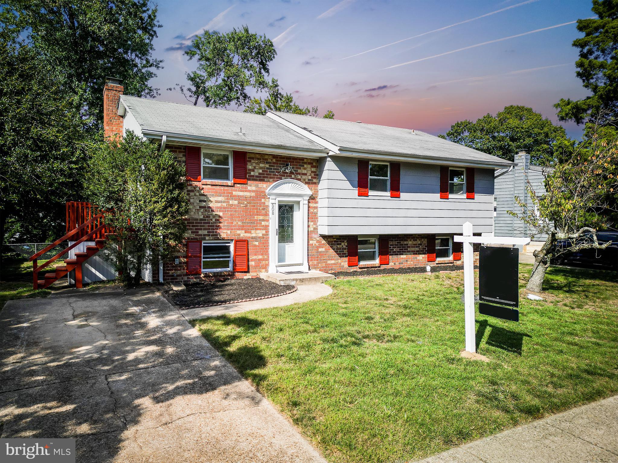 a front view of a house with a yard and porch