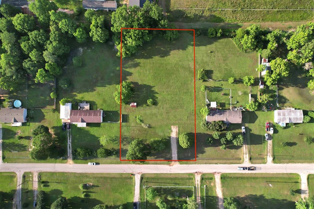 an aerial view of residential house with outdoor space and lake view