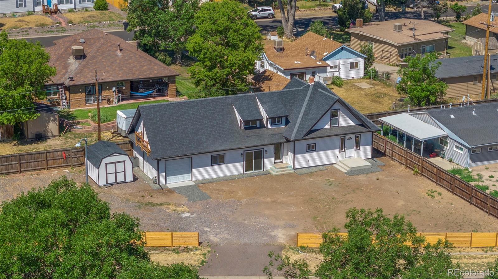 an aerial view of a house with a garden