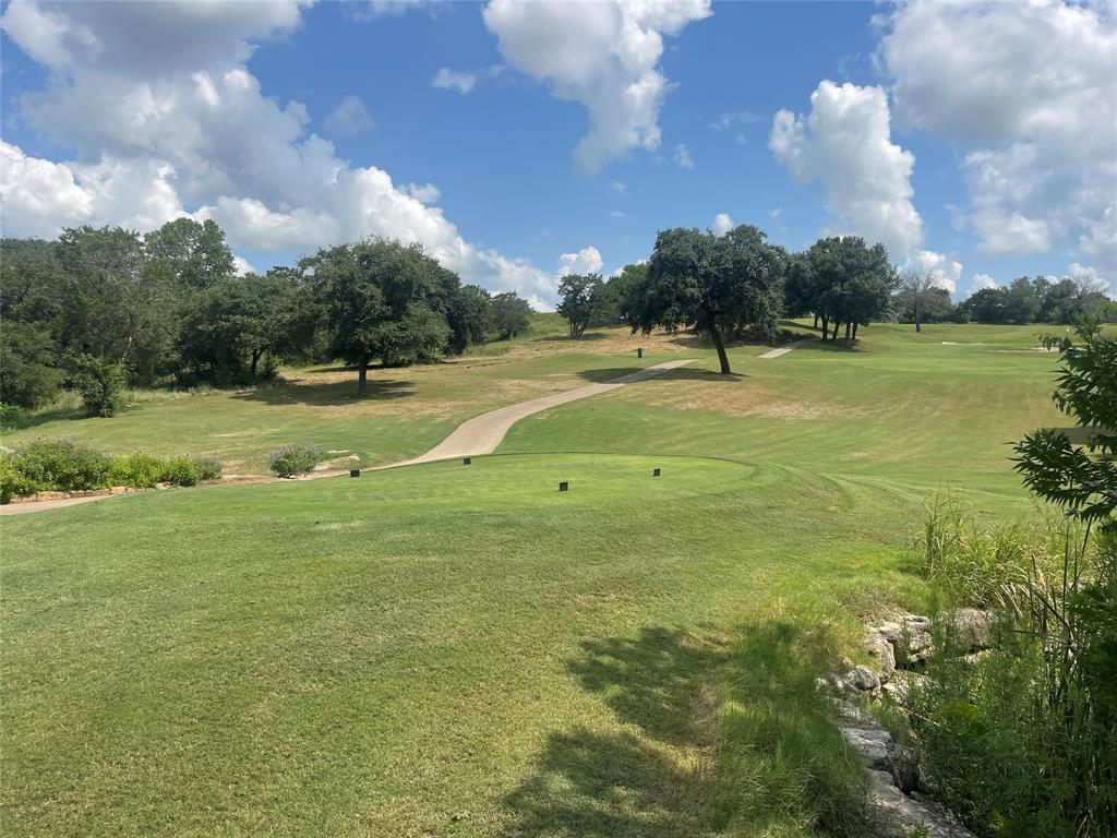 a view of a golf course with a lake