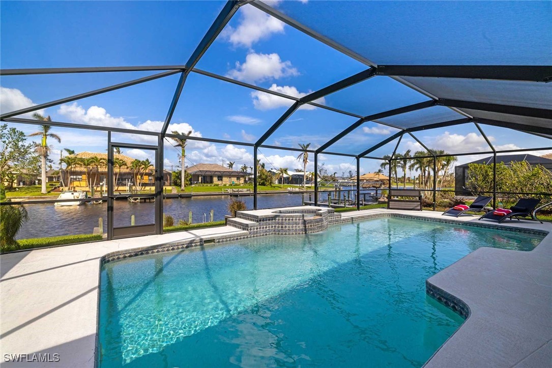 a view of a swimming pool with a patio