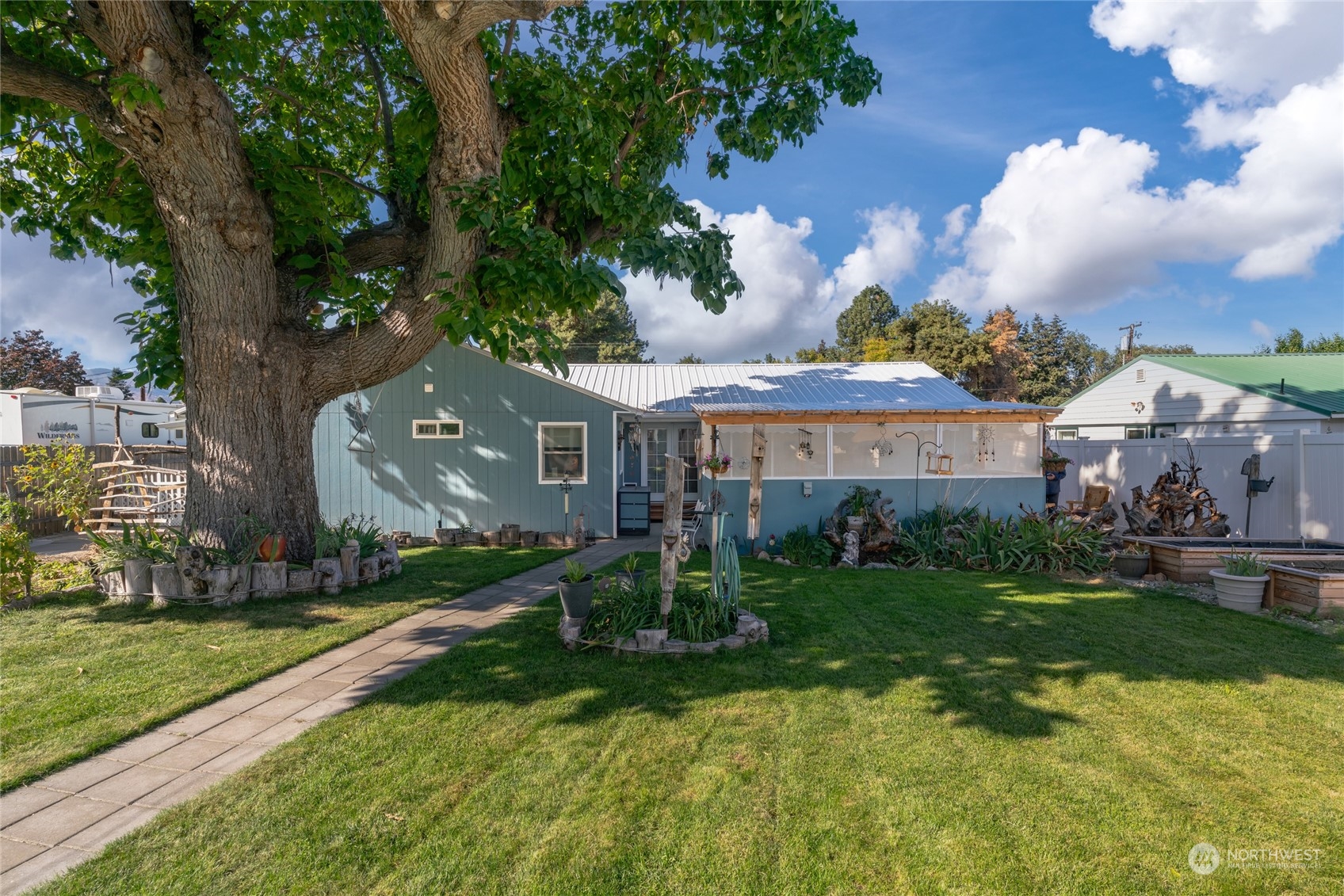 a front view of house with yard and green space