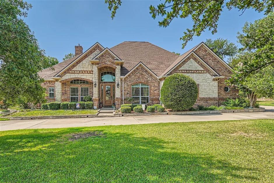 front view of a house with a yard