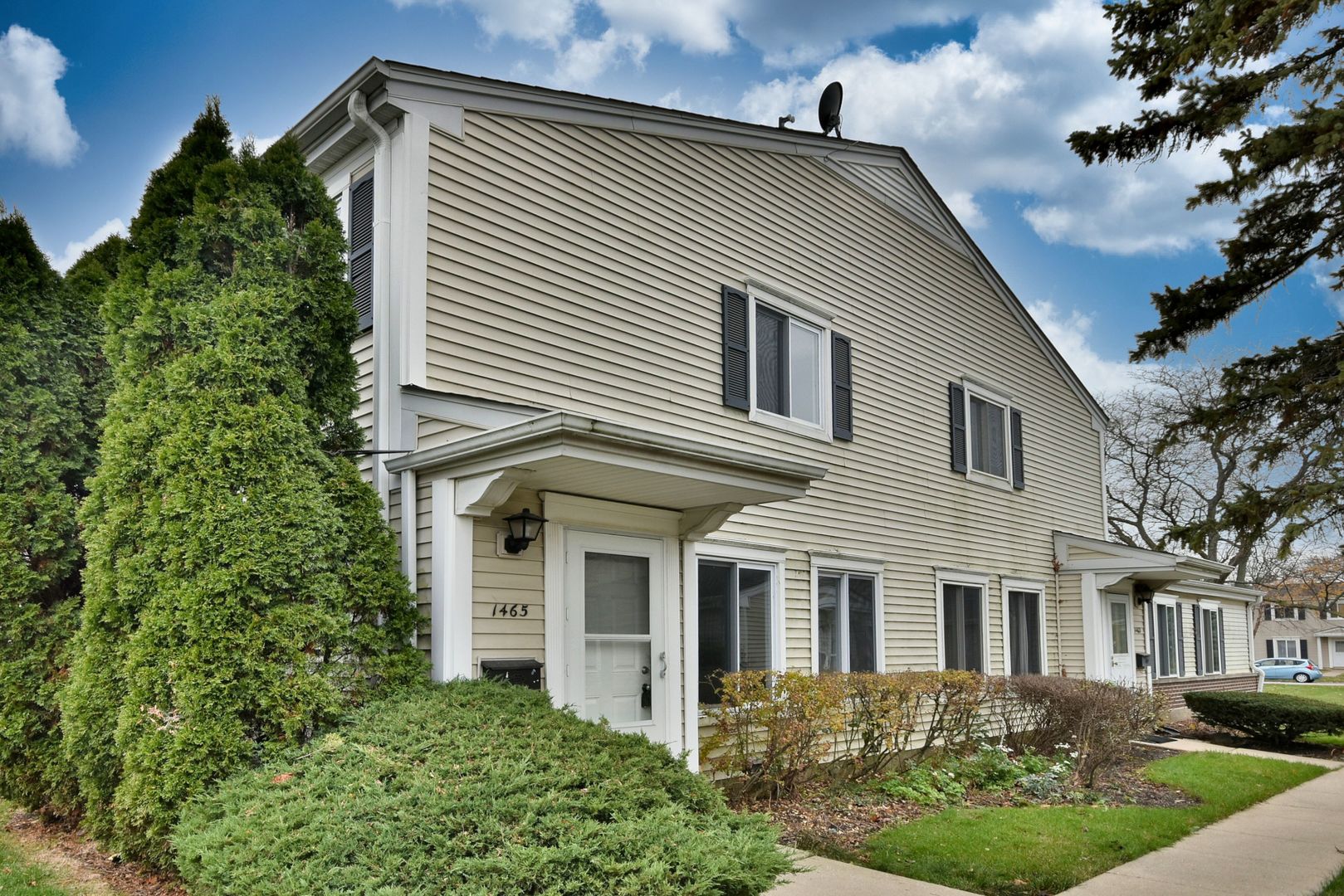 a front view of a house with a yard