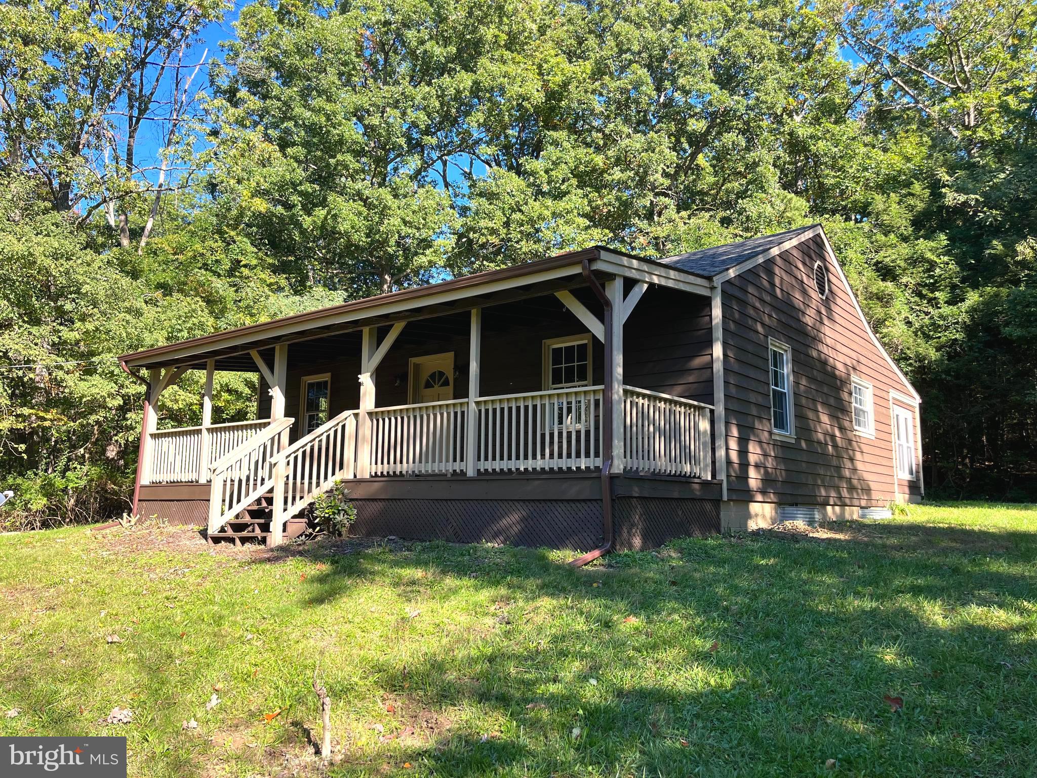 a view of house with backyard space and garden