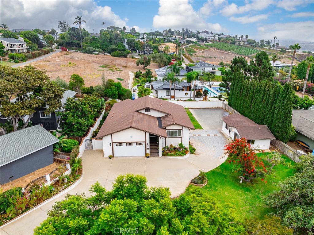 an aerial view of multiple houses with yard