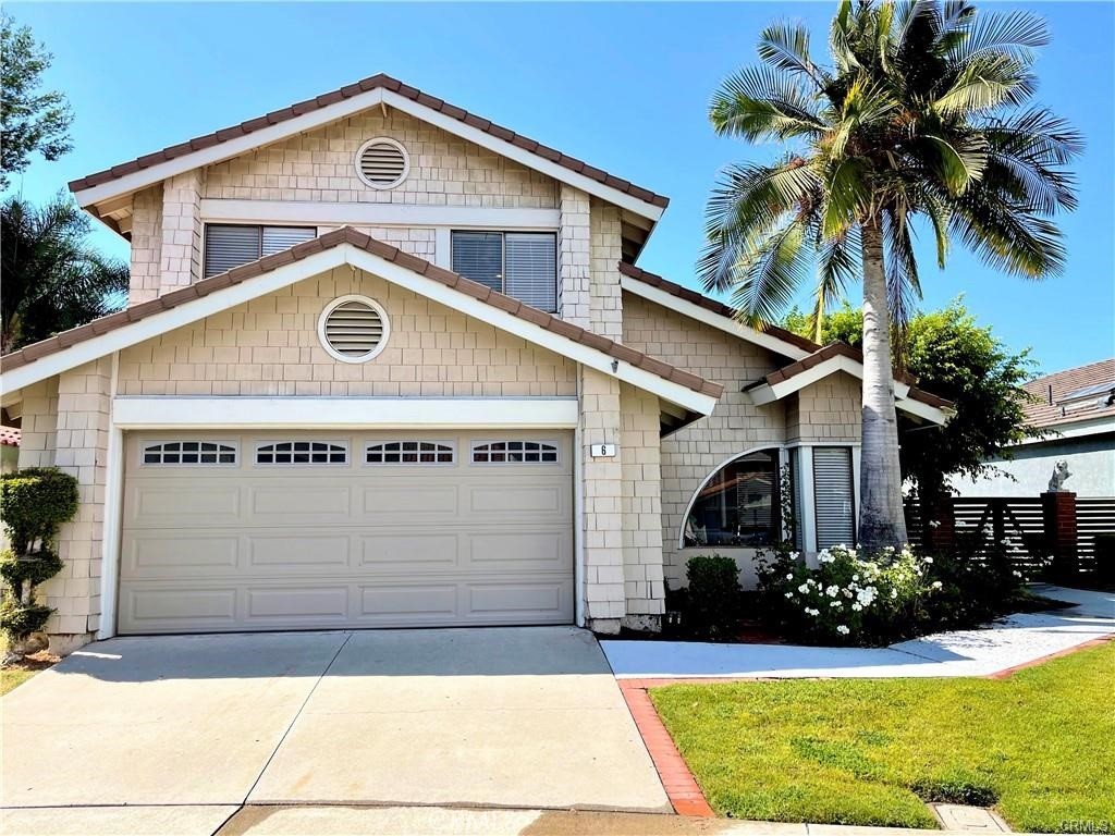 a front view of a house with yard