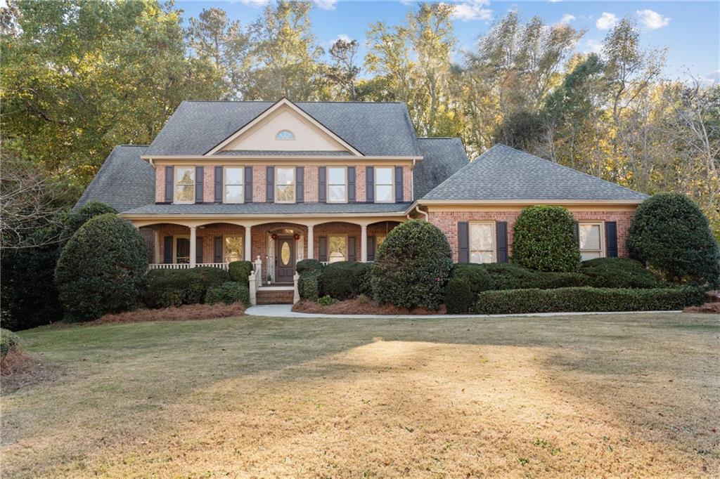 a front view of a house with a yard