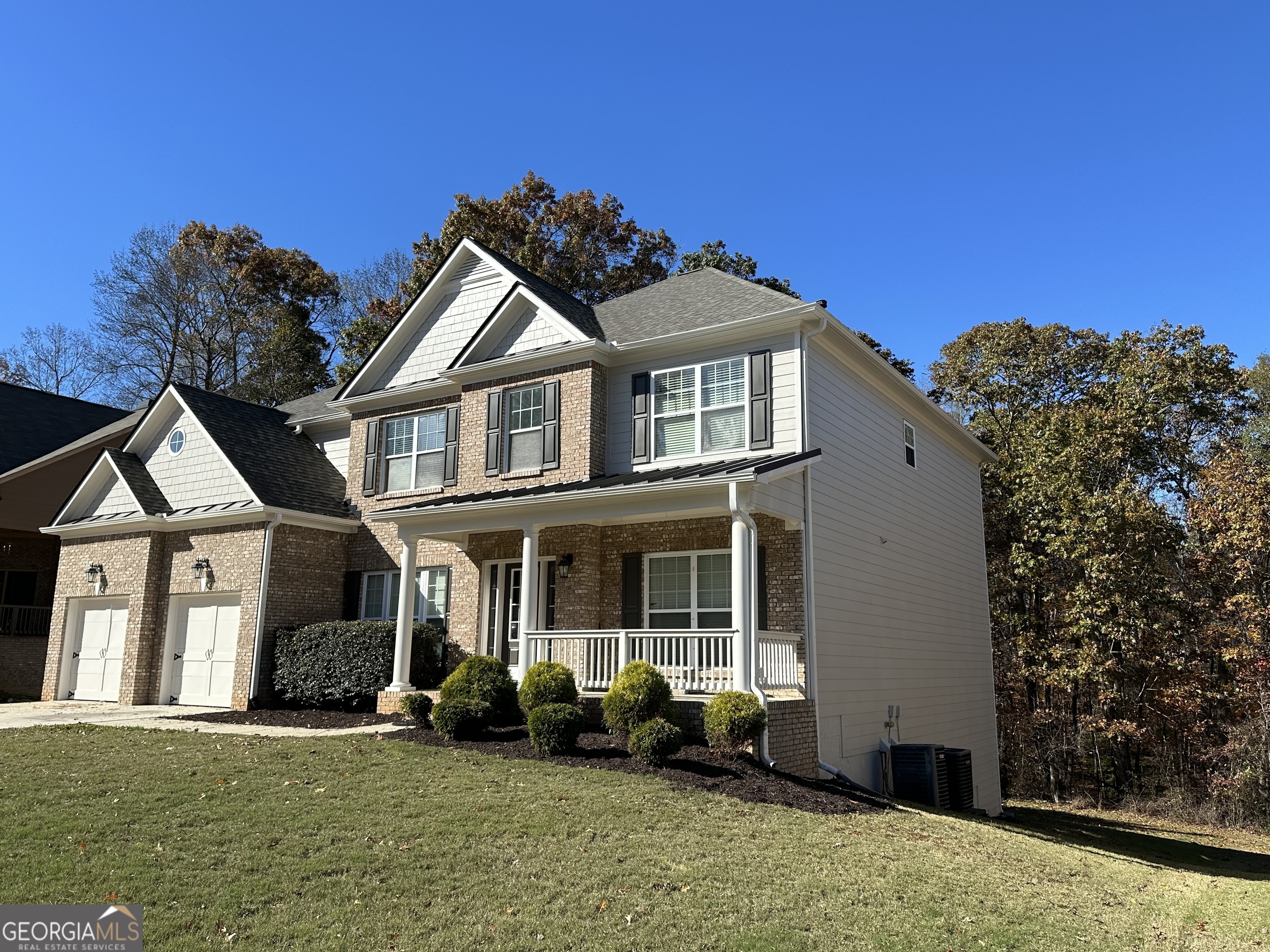 a front view of a house with a yard