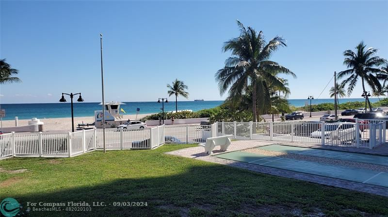 a view of a backyard and swimming pool