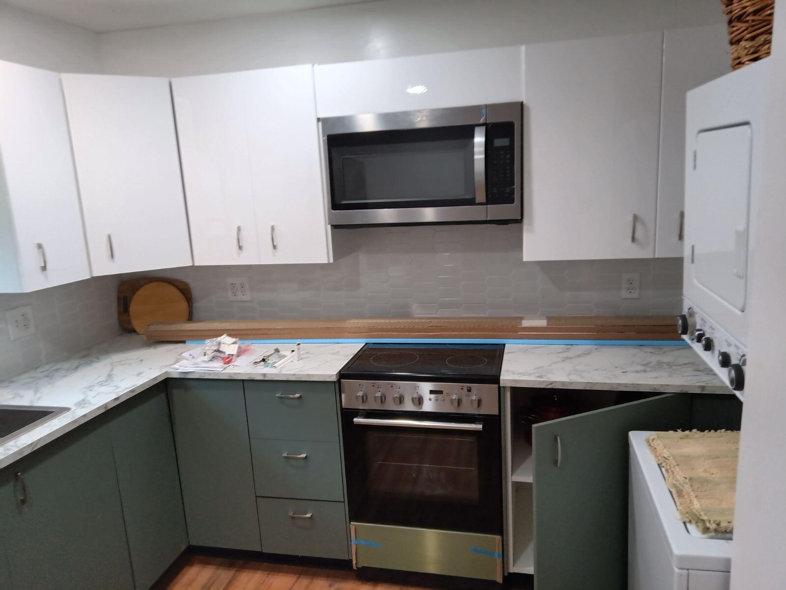 a kitchen with a stove and a microwave