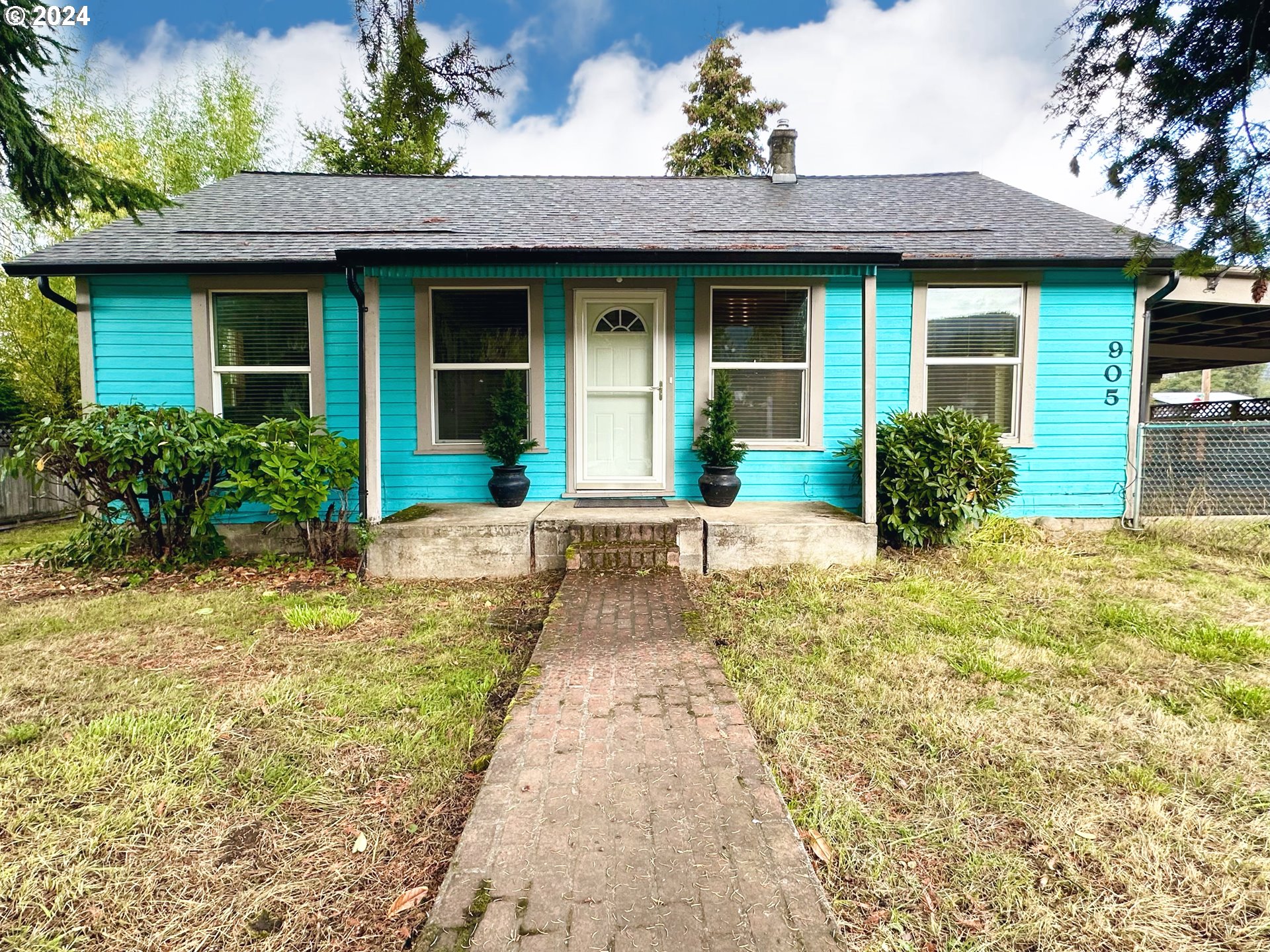 a front view of a house with garden