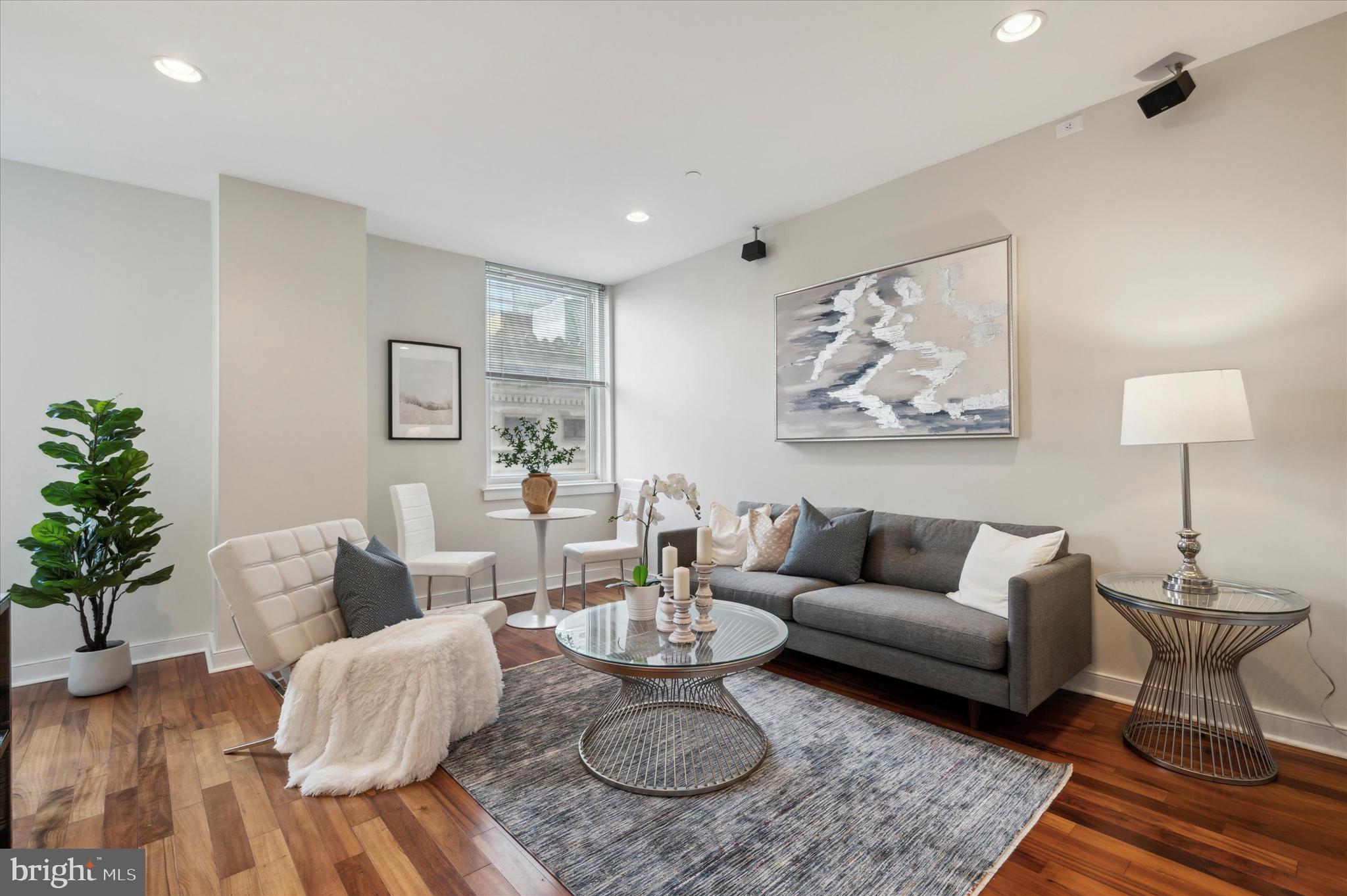 a living room with furniture and a table