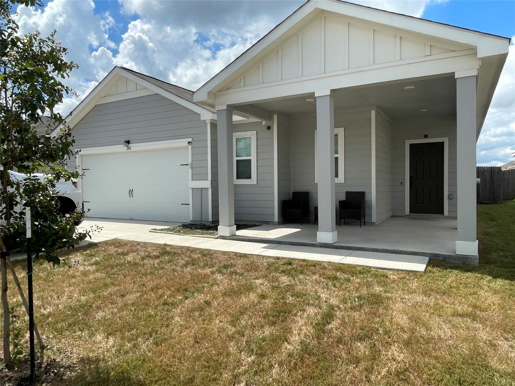 a view of yellow house with a outdoor space