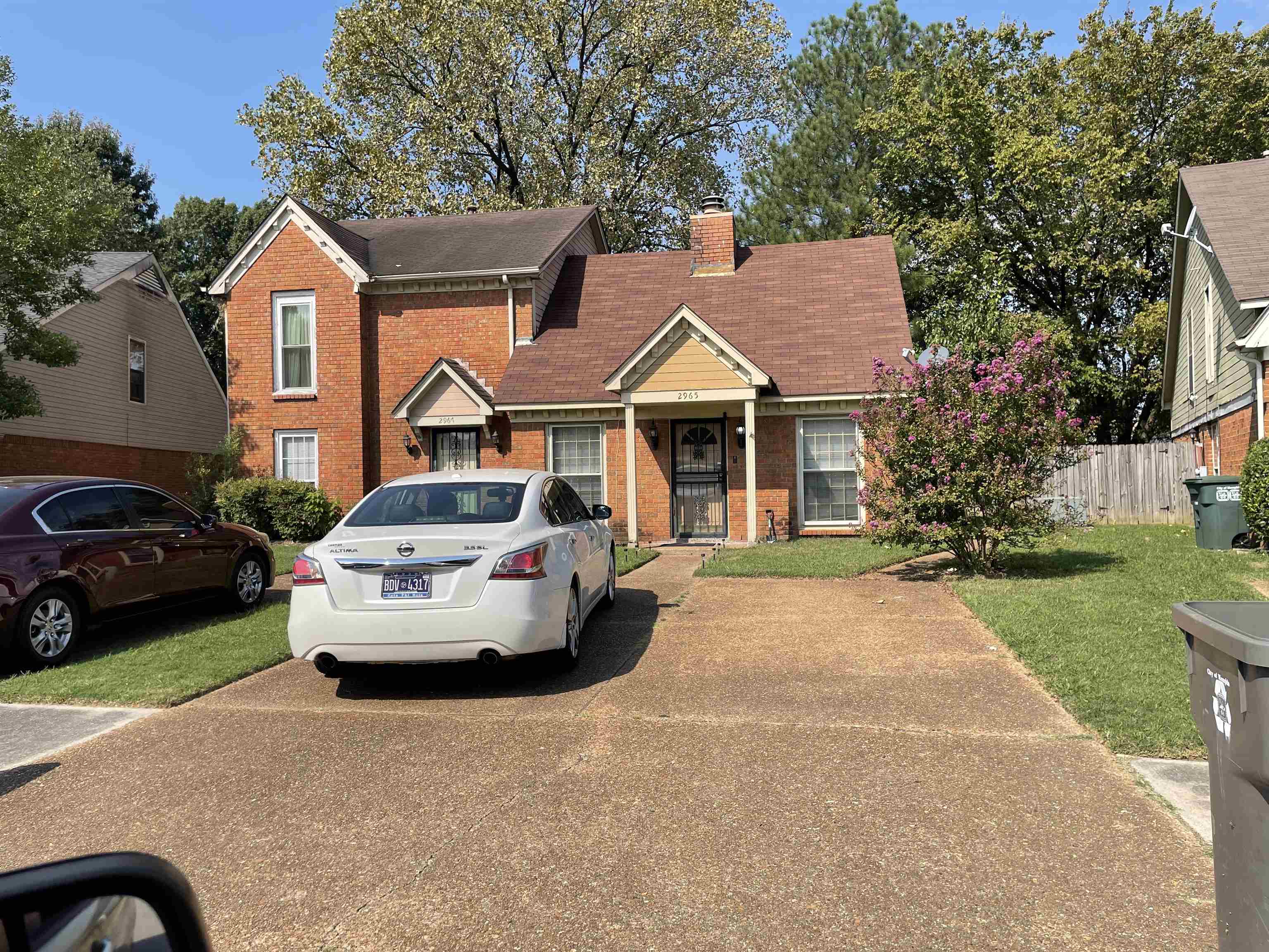 a car parked in front of a house