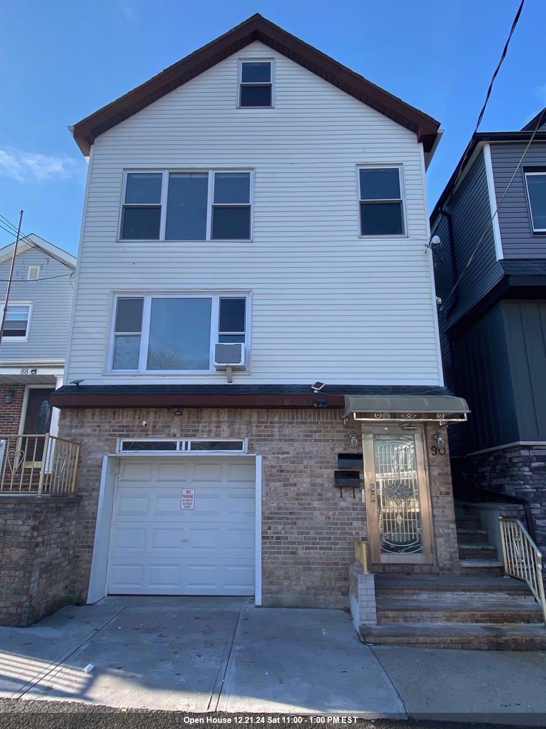 a front view of a house with a garage