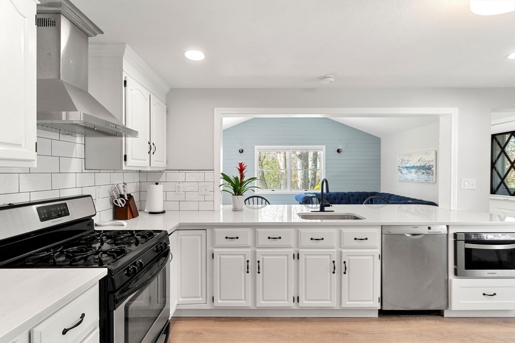 a kitchen with a stove and a sink