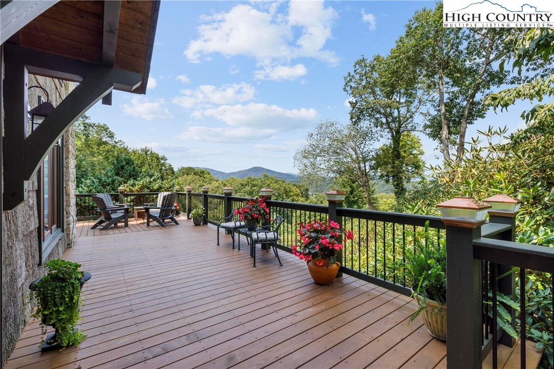 a view of a balcony with wooden floor