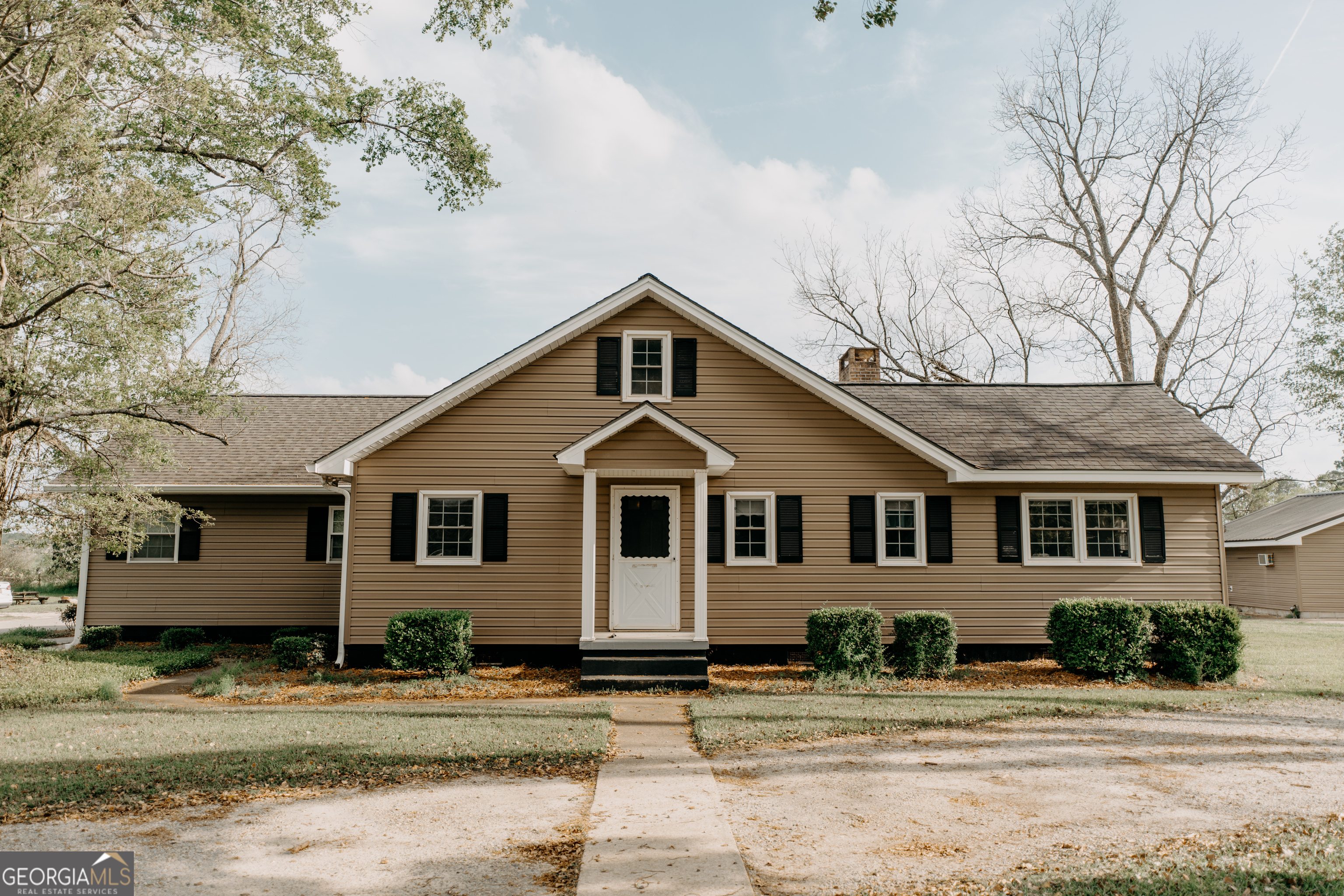 a front view of a house with a yard