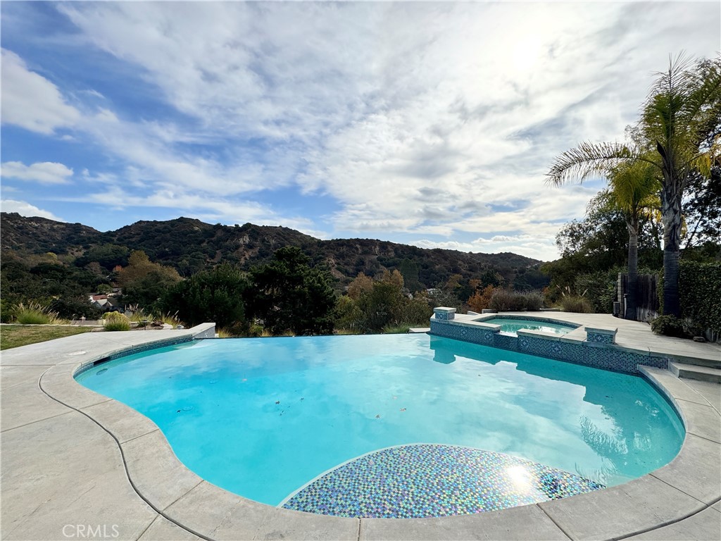 a view of a swimming pool with a yard