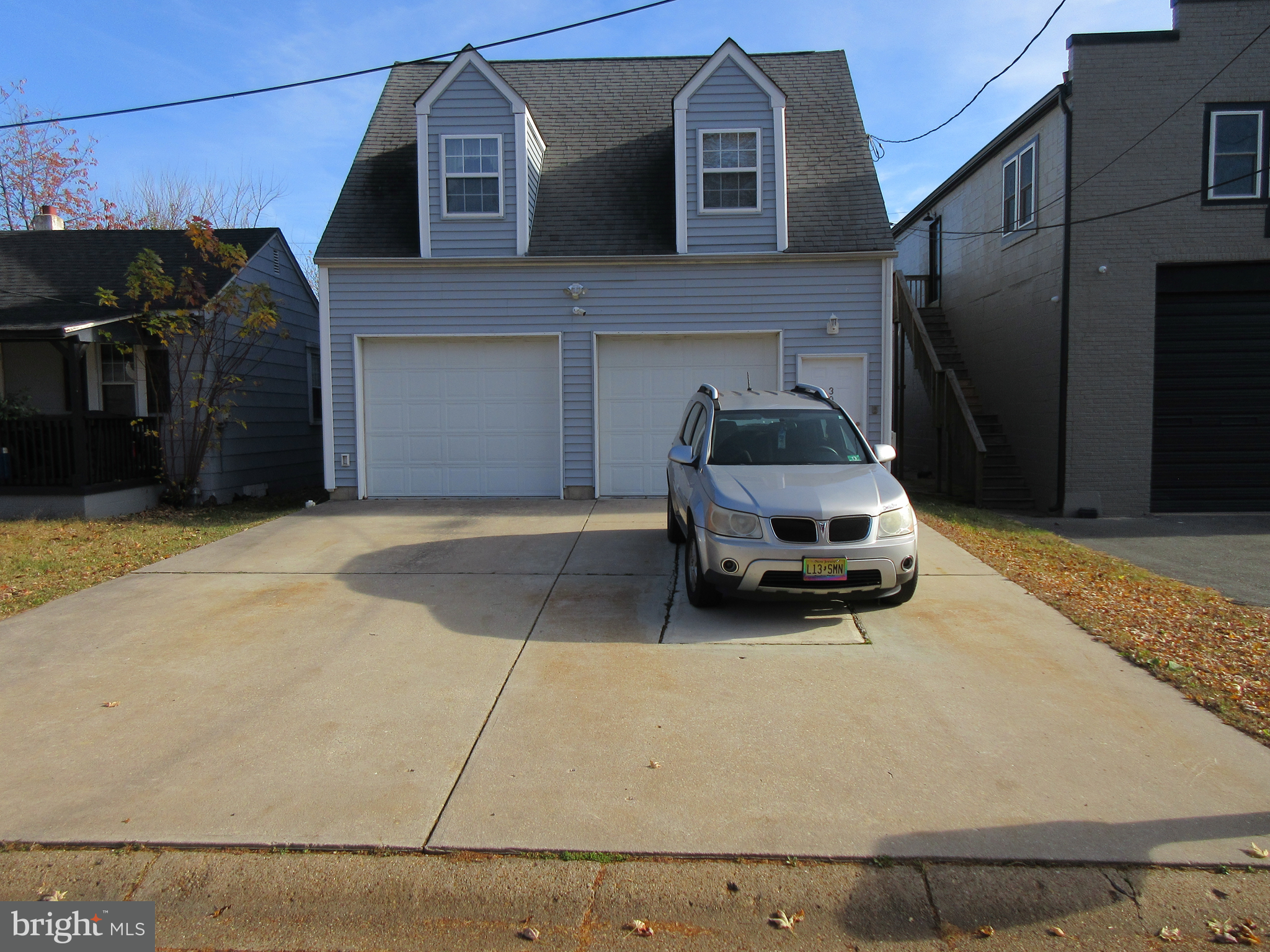 a car parked in front of a house