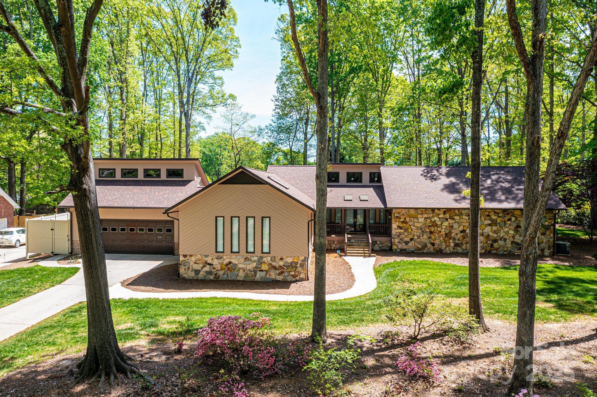 a front view of a house with garden