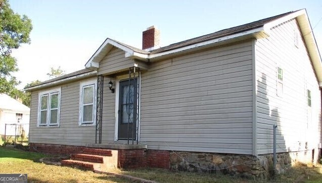 a front view of a house with garage