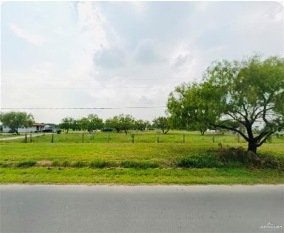 a view of a field with a big yard