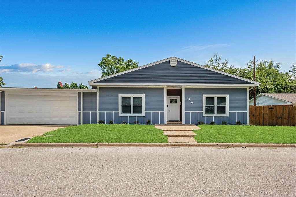 front view of a house with a yard