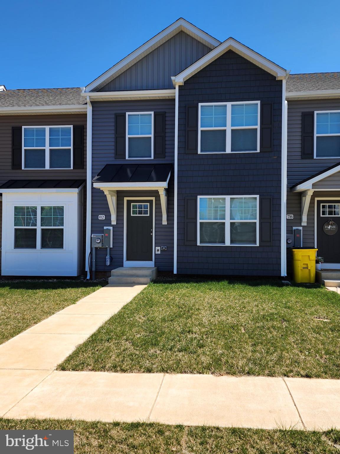 a front view of a house with yard