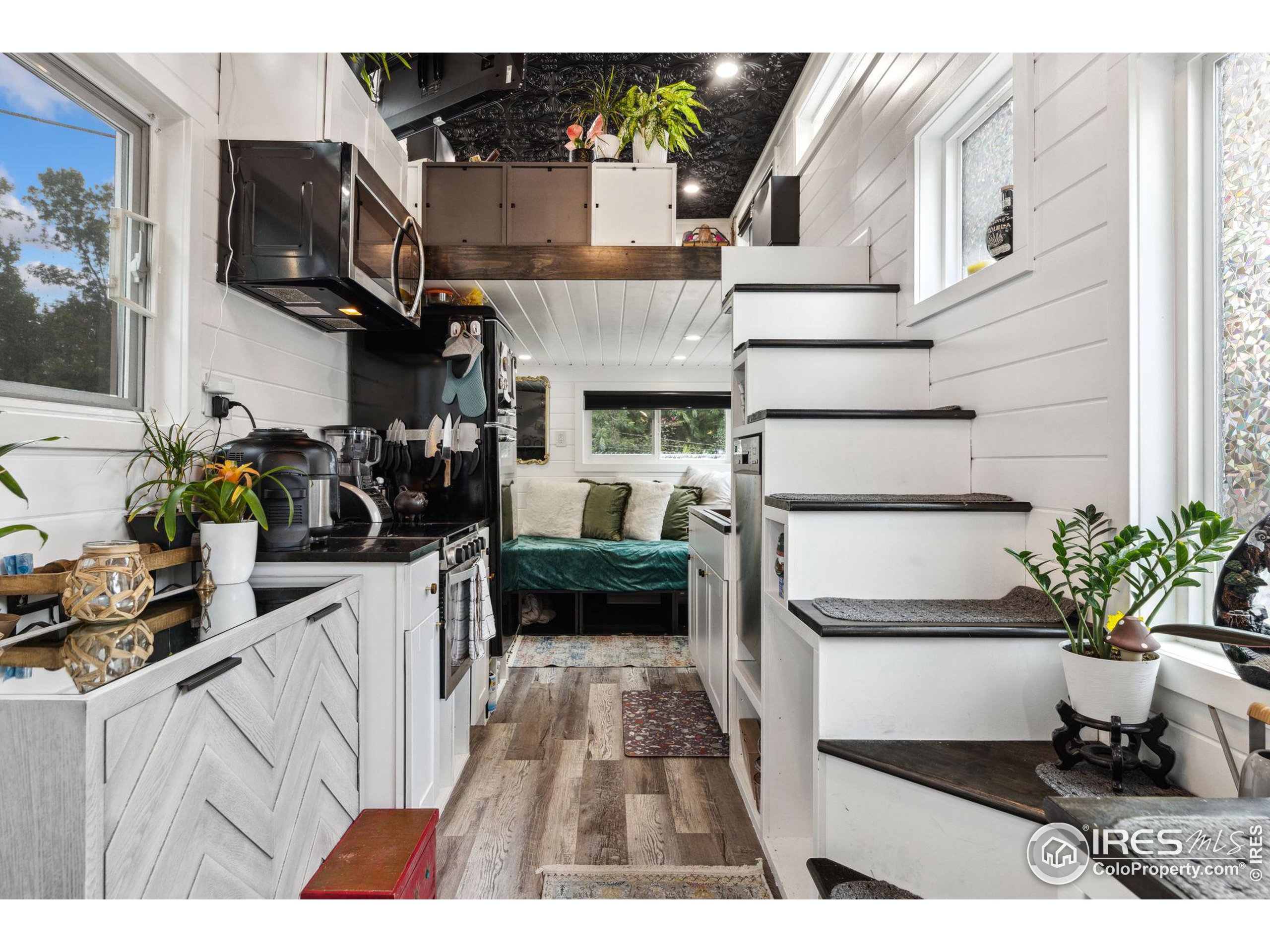 a kitchen with a refrigerator and a sink