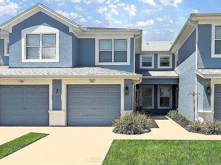 a front view of a house with a yard