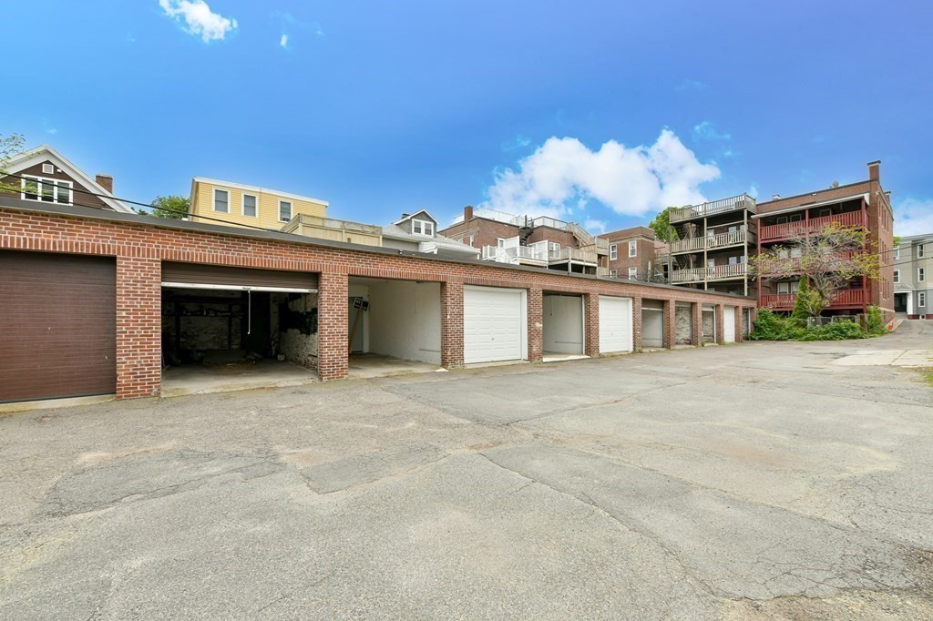 a view of a house with a garage and a fireplace