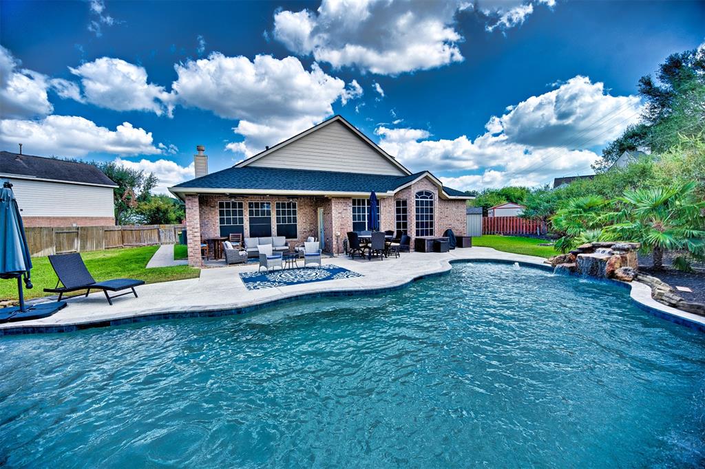 a view of a patio with swimming pool garden and patio