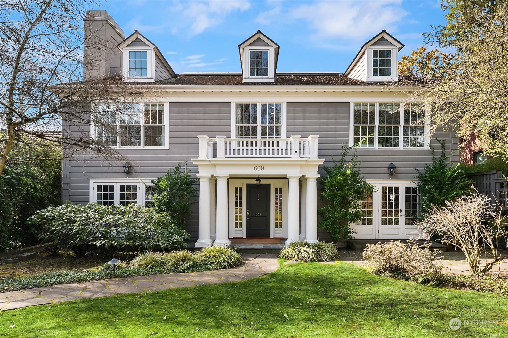 front view of a house with a yard