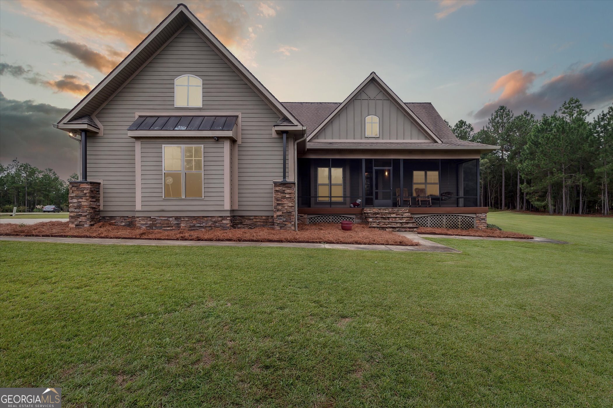 a front view of a house with garden