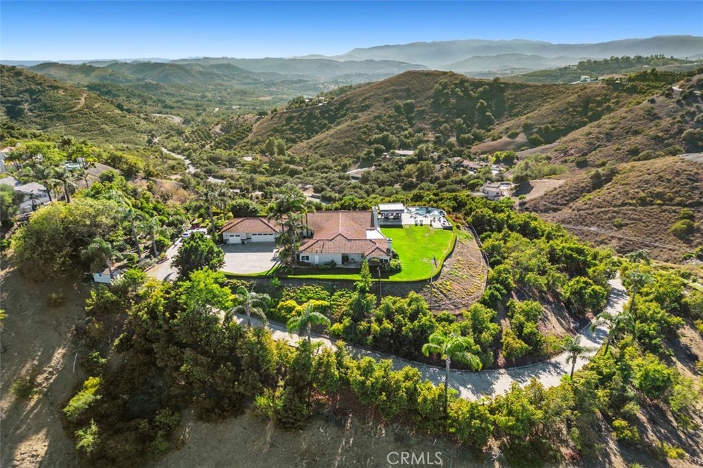 Scenic views, infinity pool, and avocado and citrus orchards.