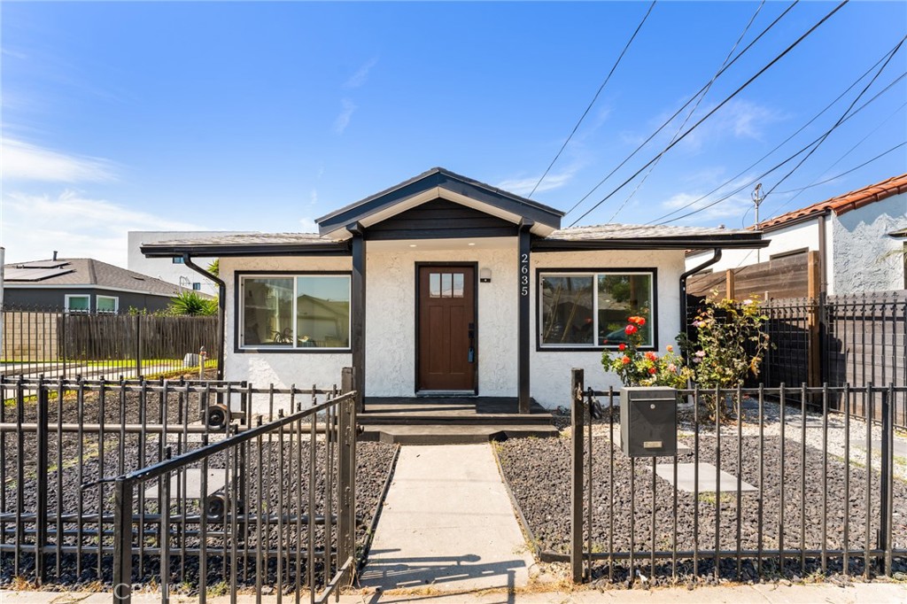 a front view of a house with glass windows